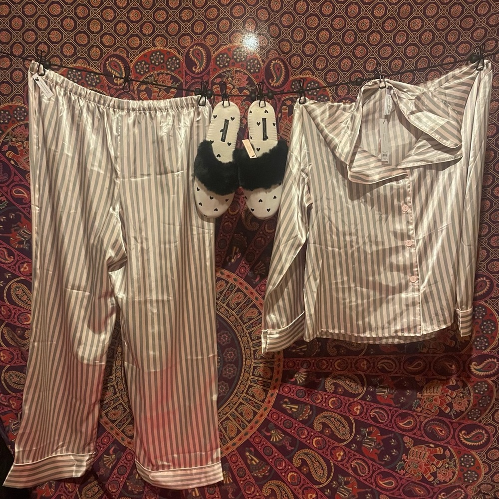 Women’s large silk pajamas with medium Victoria secrets slippers.